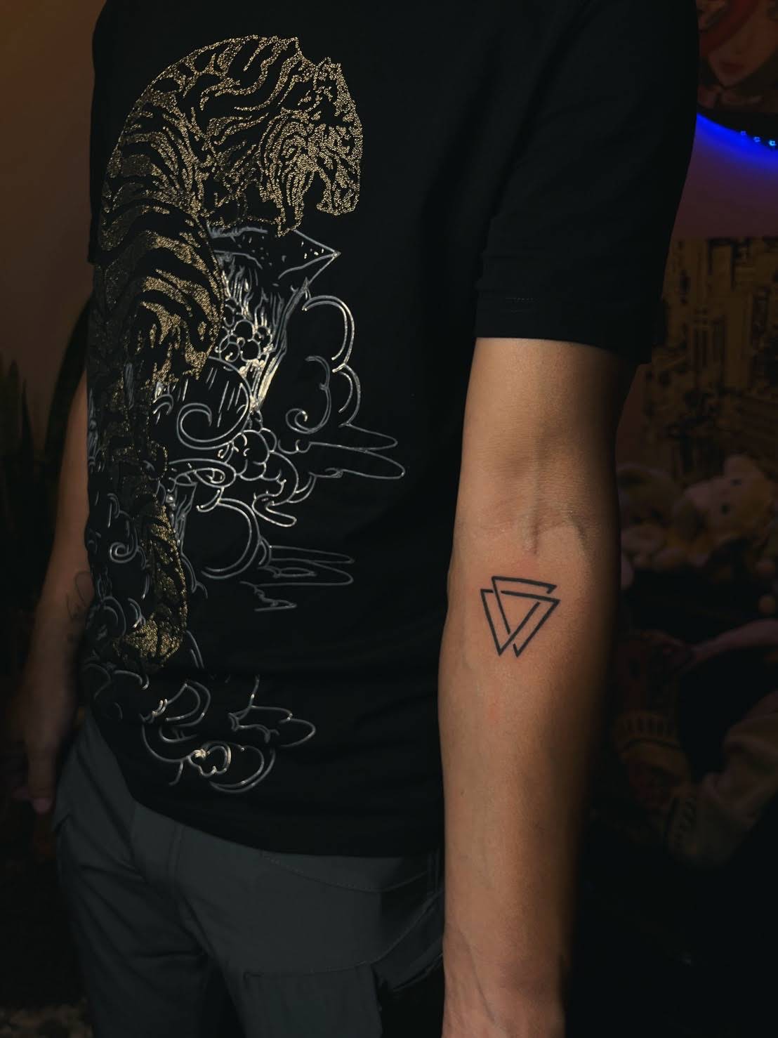 Geometric interlocking triangles Valknut symbol tattoo on forearm