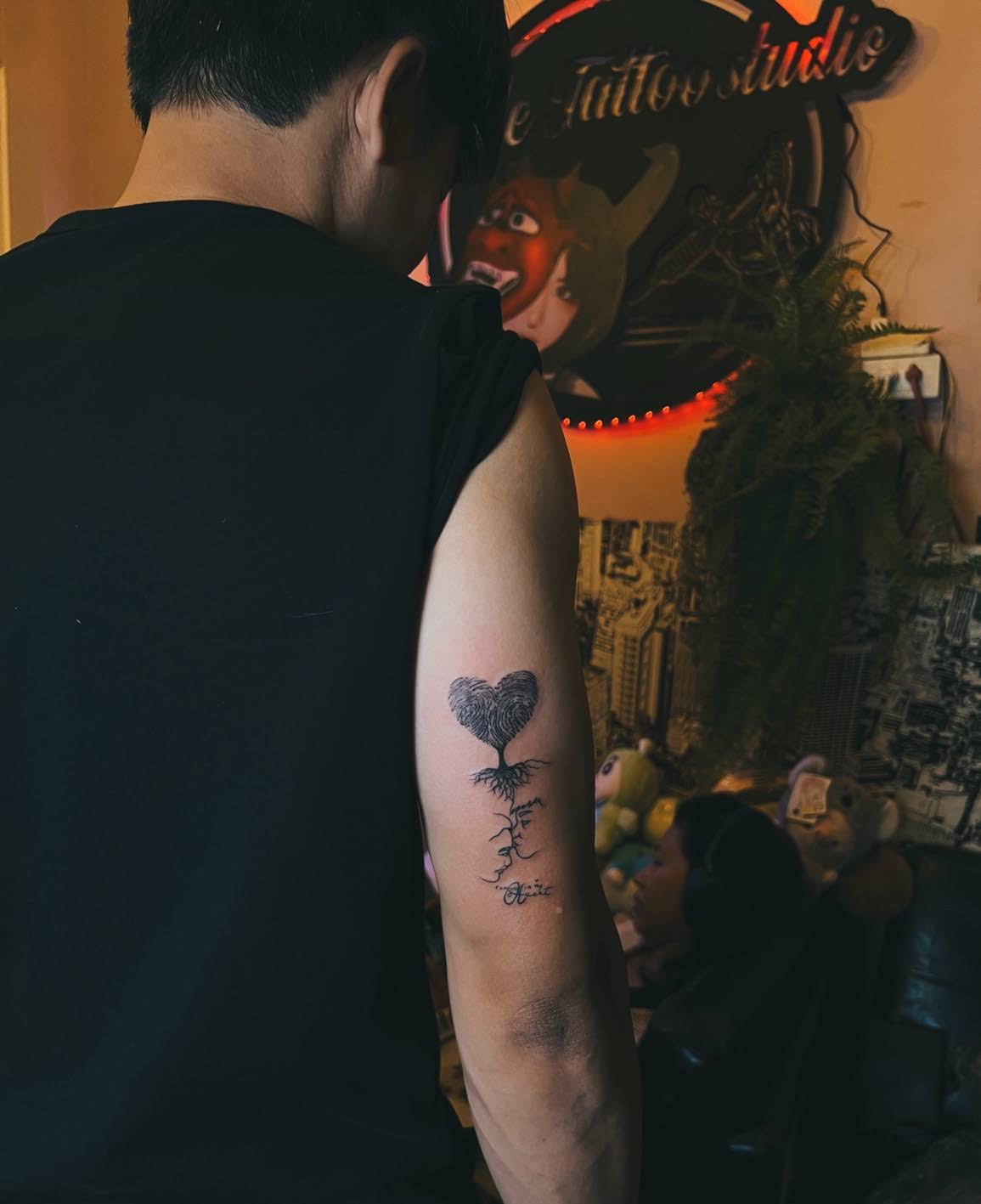 Fingerprint heart-shaped tree with roots and script memorial tattoo on upper arm