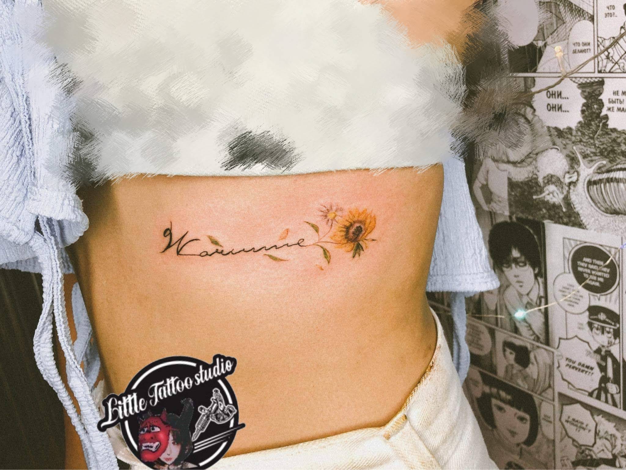 Color sunflowers with script name floral tattoo on ribcage